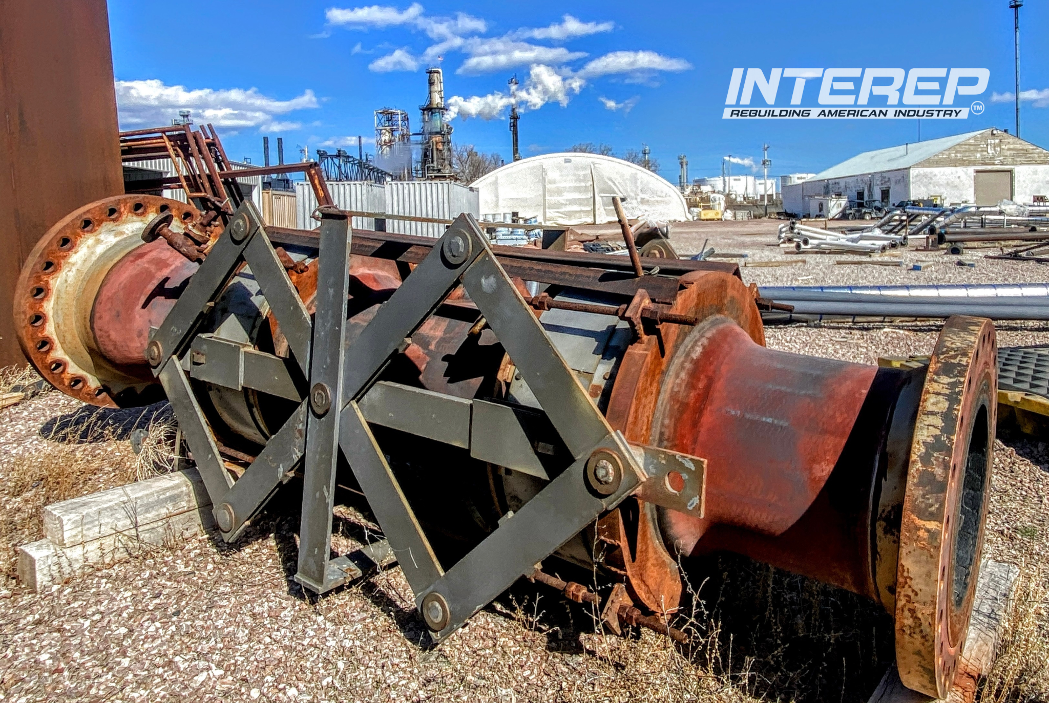 INTEREP inspection image showing a retired metal bellows expansion joint with external restraining hardware